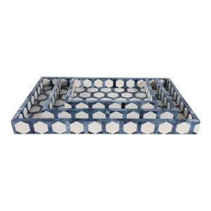 A rectangular nesting tray set with a blue and white geometric pattern of repeating hexagons, shown on a plain white background.