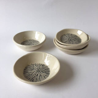 Set of ceramic bowls with decorative patterns on a white background
