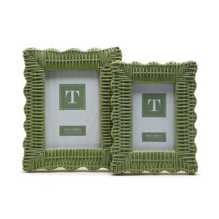 Green rattan wicker photo frame holding a 4 x 6 photo