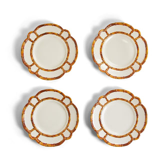 A set of four white melamine dinner plates with a bamboo rimmed design. 