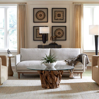 Living room with a Freefall sofa, wooden coffee table, and decorative elements.