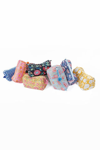 Set of colorful fabric bags on a white background