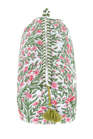 Floral patterned bag with a tassel on a white background