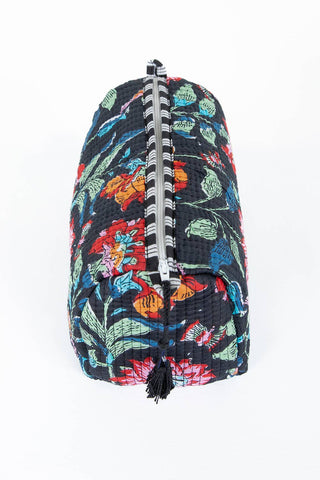 Floral-patterned backpack with a zipper on a white background