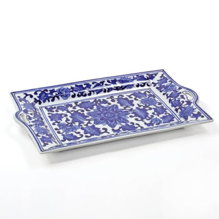 A rectangular porcelain tray with blue floral patterns on a white background, with handles on the sides.