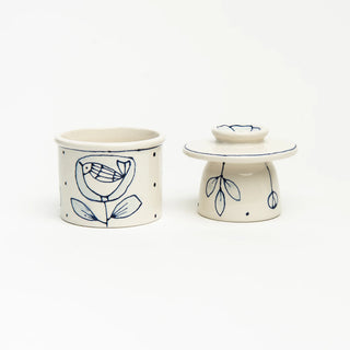 French butter crock with hand painted blue designs. No two are alike