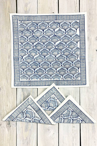 A set of four blue and white hand-block printed cotton napkins with the Blue Lotus design