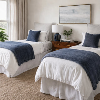 navy blue throw pillows decorated on  a bed
