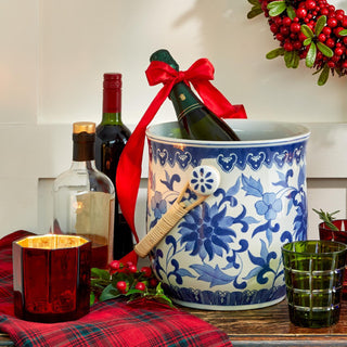 This blue and white Asian-inspired ice bucket with rattan basket handle add global style to your bar
