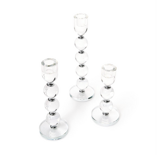 Set of 3 bobbin-style crystal glass taper candlesticks in varying heights
