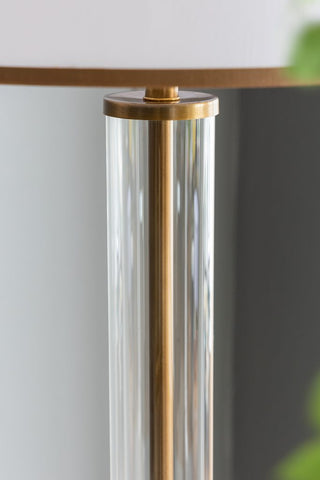 close up of glass cylinder on floor lamp