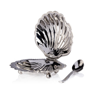 Silver shell-shaped salt cellar with a spoon 