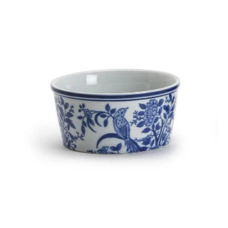 A small white ceramic bowl with a blue floral and bird pattern, shown on a plain white background.