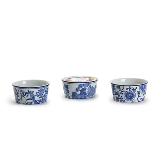 Three ceramic bowls with blue floral patterns on a white background