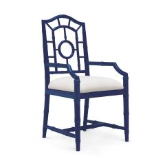 A navy blue armchair with a solid mahogany frame and a linen drop-in cushion, featuring a fretwork backrest and faux bamboo detailing.
