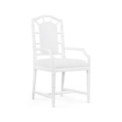 The Delia Armchair in vanilla color, showcasing a modern design with a solid mahogany frame carved to mimic bamboo, and a Snow White linen cushion.