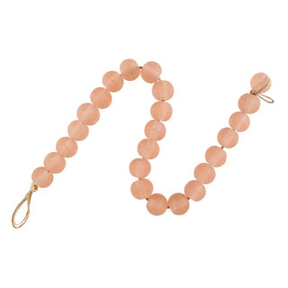 Pink beaded garland on a white background