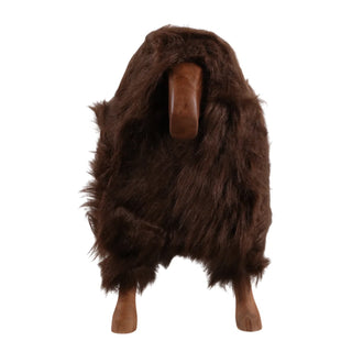 A dark brown faux fur or sheepskin-style animal costume cover with a long shaggy texture, displayed on a mannequin with a wooden head and legs against a plain white background.