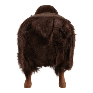 A dark brown faux fur costume or wig shown from the back on a white background, featuring a shaggy texture and light brown trim at the bottom.