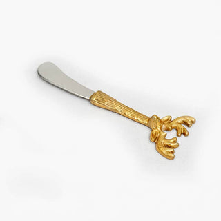 A decorative butter knife with a silver-toned metal blade and a gold-toned handle shaped like a reindeer head, shown on a plain white background.