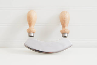 Double Bladed Mezzaluna with wooden handles makes kitchen prep easy