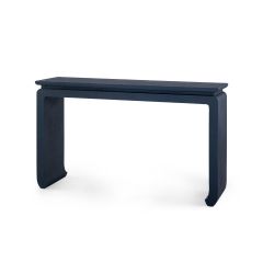 A dark blue console table with clear lacquered grasscloth and curved chow feet, gives the alter table a modern update