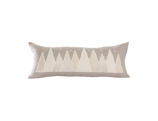 Decorative pillow with embroidered holiday tree pattern on a white background