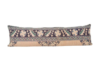 An extra long vintage Anatolian pillow cover with geometric and floral patterns in beige, blue, and green colors.