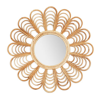 This nature inspired wall mirror has a flower petal structure and natural cane frame