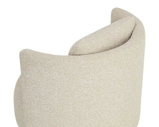 Textured beige cushion with a soft finish on a white background