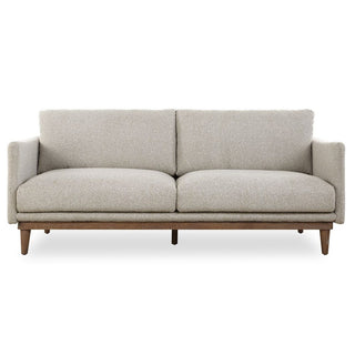Beige sofa with wooden legs on a white background