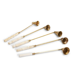 Set of five brass and ivory-handled ladles on a white background