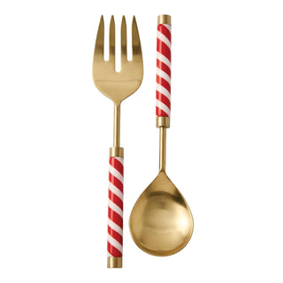Gold-colored flatware set featuring a dinner fork and a serving spoon with red and white striped handles, isolated on a white background.