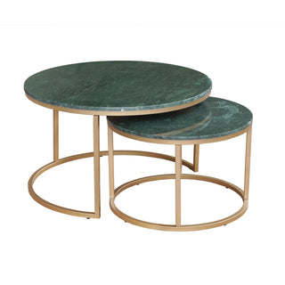 Set of two round marble tables with gold metal bases on a white background
