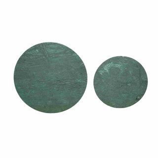 Two green circular objects on a white background