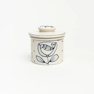 Ceramic butter crock with blue floral design are each hand painted