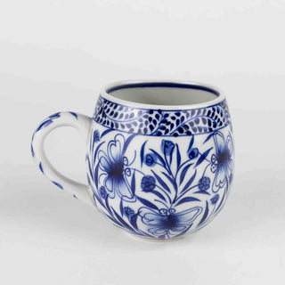 Blue and white ceramic mug with blue floral patterns made in Vietnam