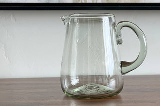 Modern, handblown Clear glass pitcher is a classic serveware piece
