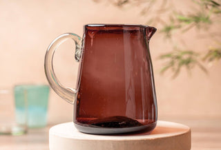 Handblown smoky brown glass pitcher is a modern serveware staple
