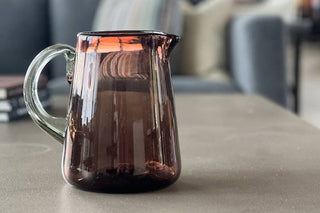 Brown glass pitcher matches any table decor