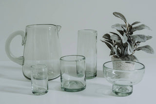 Set of modern clear glassware including a handblown pitcher and margarita glasses