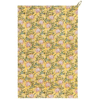 Floral patterned towel with pink flowers on a yellow background