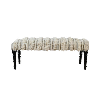 Textured bench with black legs on a white background