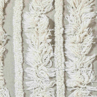 Close-up of a textured woven textile with vertical raised stripes in off-white and cream on a light beige background.