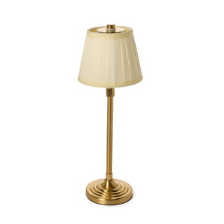 Cordless table lamp with a beige shade and gold base 