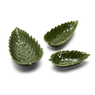 A set of three ceramic bowls with an intricate fern leaf design in green color.