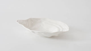 White melamine bowl on a light gray background