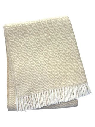 Beige and white herringbone patterned throw blanket on a white background