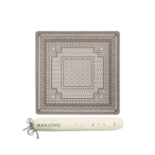 A square mahjong tile set displayed on a white background, featuring a detailed geometric pattern in gray and beige. Below the tile is a rolled cream-colored carrying case with the brand name 'MAHJONG' printed on it.
