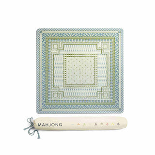 A square mahjong tile set with a geometric pattern in light blue, green, and cream, shown above a cream-colored carrying case labeled 'MAHJONG' on a plain white background.